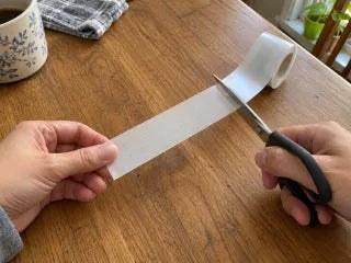 Cutting a fresh length of silicone scar roll